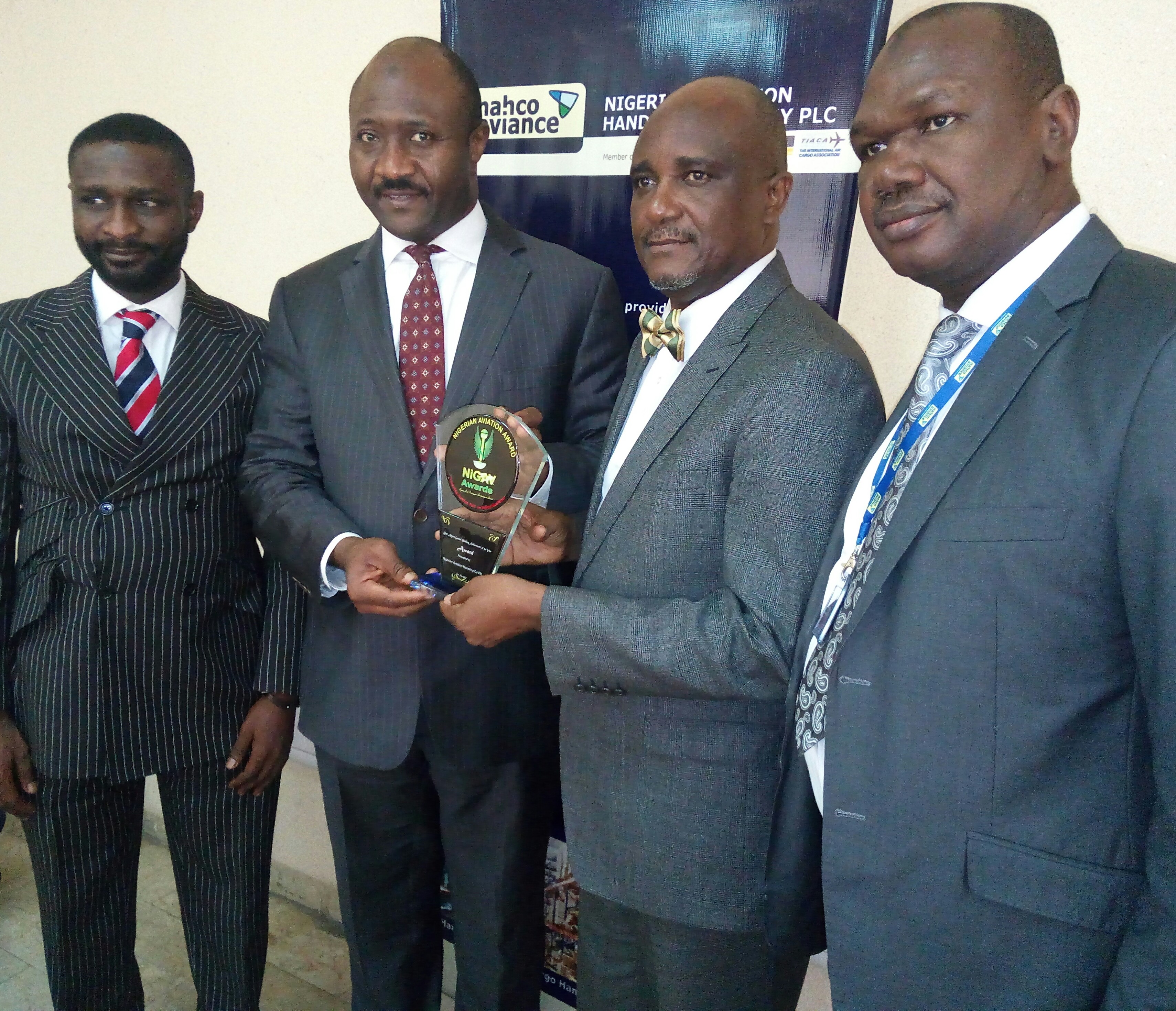 1. 2nd from left, Mr. Mr. Idris Yakubu, MD/CEO of nahco aviance, Mr. Idris Yakubu; left, Mr. Baba Yusuf, Group General Manager, Business Development & Strategy, nahco aviance; Mr. Fortune Idu, Chairman, FCI, organisers of NIGAV Awards and Mr. Ahmed Bashir Gulma, Head, Corporate Services, nahco aviance, during the handing over of the Airport Groundhandling Special Achievement Award to the nahco aviance’ boss at the nahco aviance House, Ikeja, Lagos