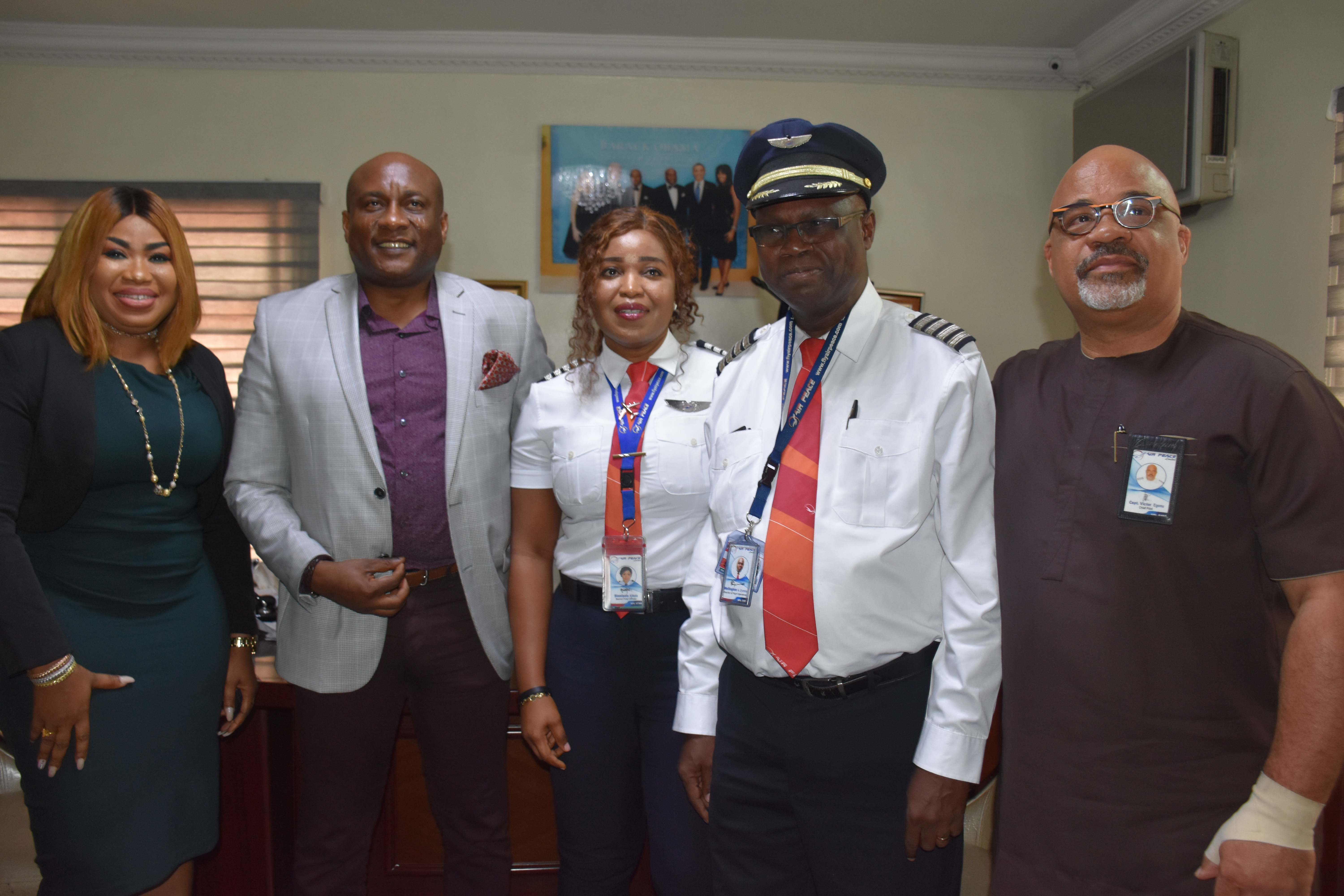 Air Peace first female Captain,Sinmisola Ajibola flanked by the airline’s Chairman/Chief Executive Officer, Mr. Allen Onyema (2nd left), Chief Operating Officer, Mrs. Oluwatoyin Olajide (left), Director of Flight Operations, Capt. Wellington Eyimina (2nd right) and Chief Pilot, Capt. Victor Egonu (right) during Sinmisola’s decoration with her new rank at the carrier’s corporate headquarters in Lagos on Monday