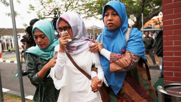 Relatives of the passengers arrive at the crisis centre at Jakarta airport