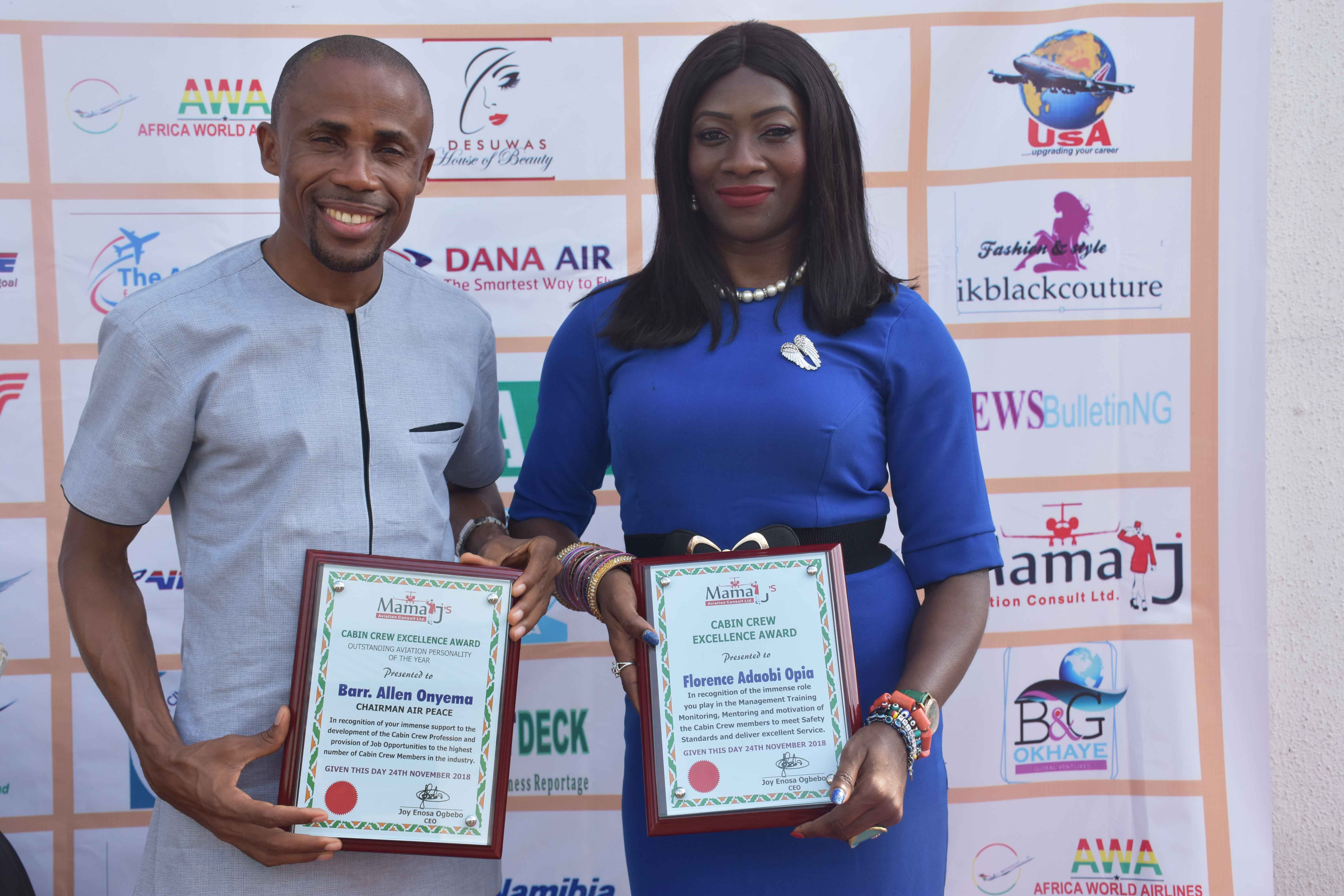 Air Peace Corporate Communications Manager, Mr. Chris Iwarah (left) and Cabin Services Manager, Ms. Florence Opia displaying the awards during the 2nd Cabin Crew Fair organised by MamaJ Aviation Consult Limited at the Nigerian Civil Aviation Authority Annex, Lagos on Saturday