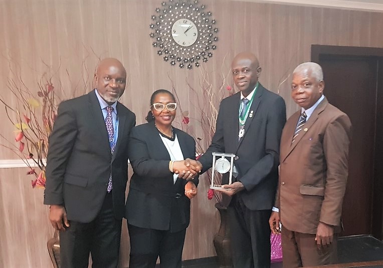 Second left, Mrs. Olatokunbo Fagbemi, Group Managing Director/CEO, nahco aviance; presenting a gift to the Ikeja Disctrict Chairman of ICAN, Mr. Oni Olalere, during the visit of officials of the Institute to the Company’s Head Office at Ikeja. With them are, from left, Mr. Bamidele Adelaja, CFO, nahco aviance; and right, Mr. Kamoru Amodu, a member of ICAN delegation.