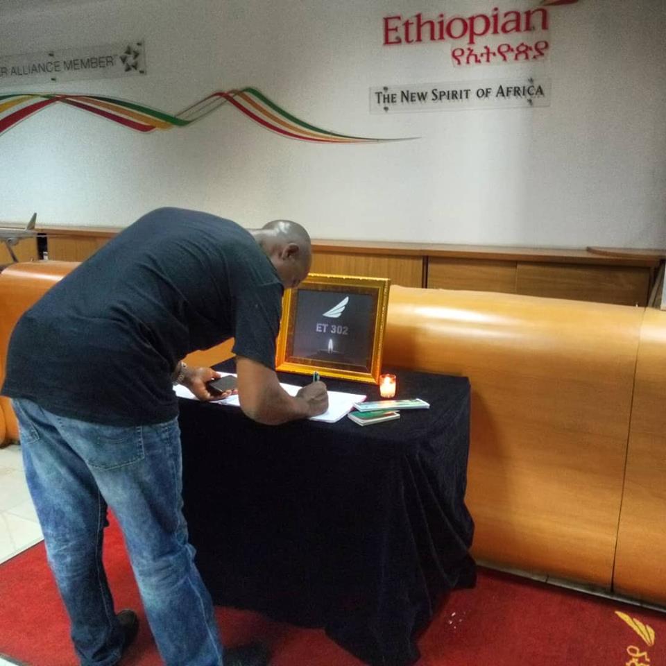 Sympathiser signing the condolence register.