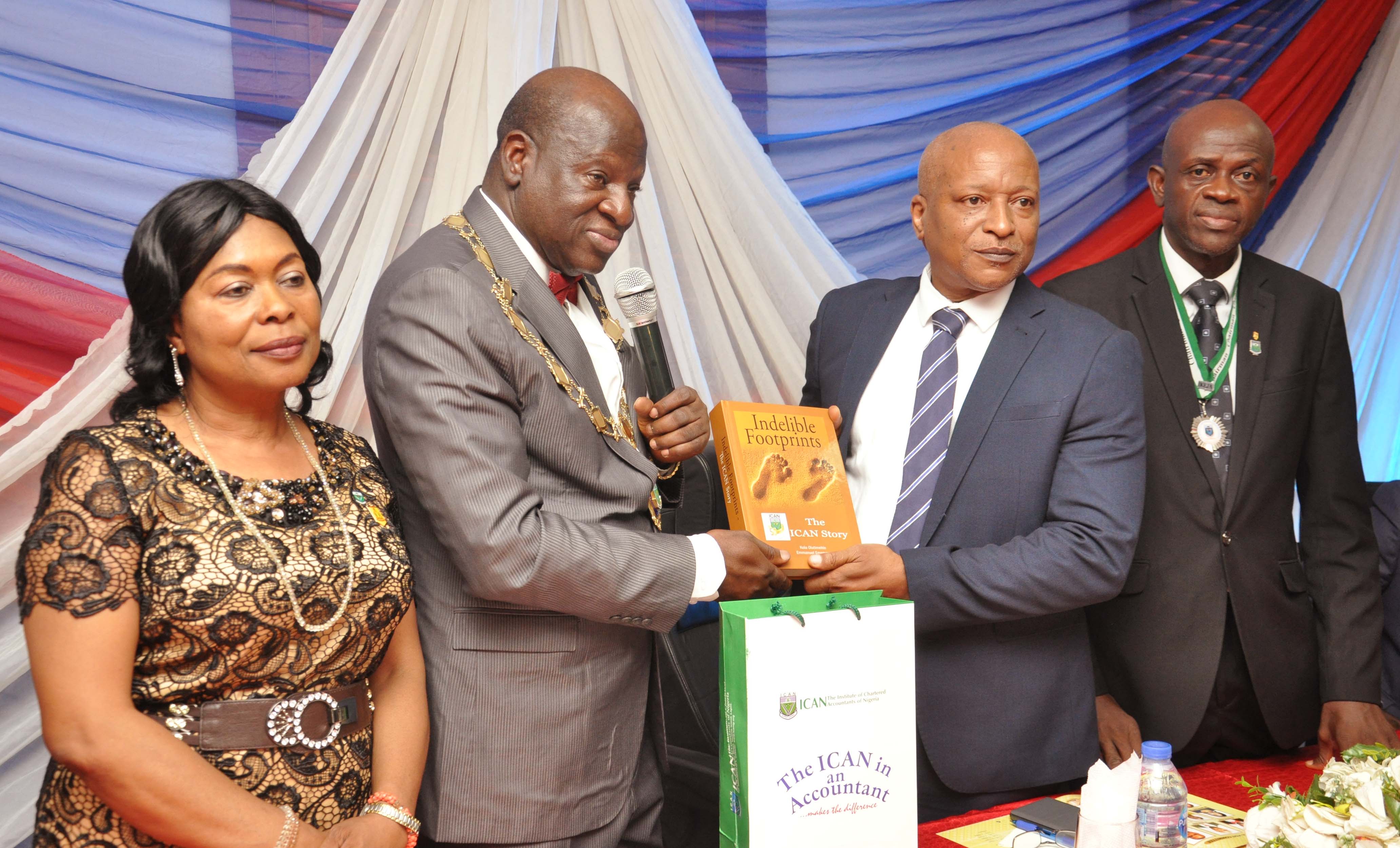 01, The 54th President, Institute of Chartered Accountants of Nigeria, (ICAN), Alhaji Razak Adeleke Jaiyeola, (2nd left) presenting book to Managing Director, Arik Air, Capt. Roy Ilegbdu, (2nd right), 2nd Deputy Vice President, (ICAN), Mrs.Comfort Olujumoke Eyitayo, (left) and Chairman, Ikeja District Society of Institute of Chartered Accountants of Nigeria (IDSICAN), Mr. Oni Olalere during the ICAN visit to Arik Air at the Murtala Muhammed Airport, Ikeja, Lagos on 18-04-2019: PHOTO: ISAAC JIMOH AYODELE