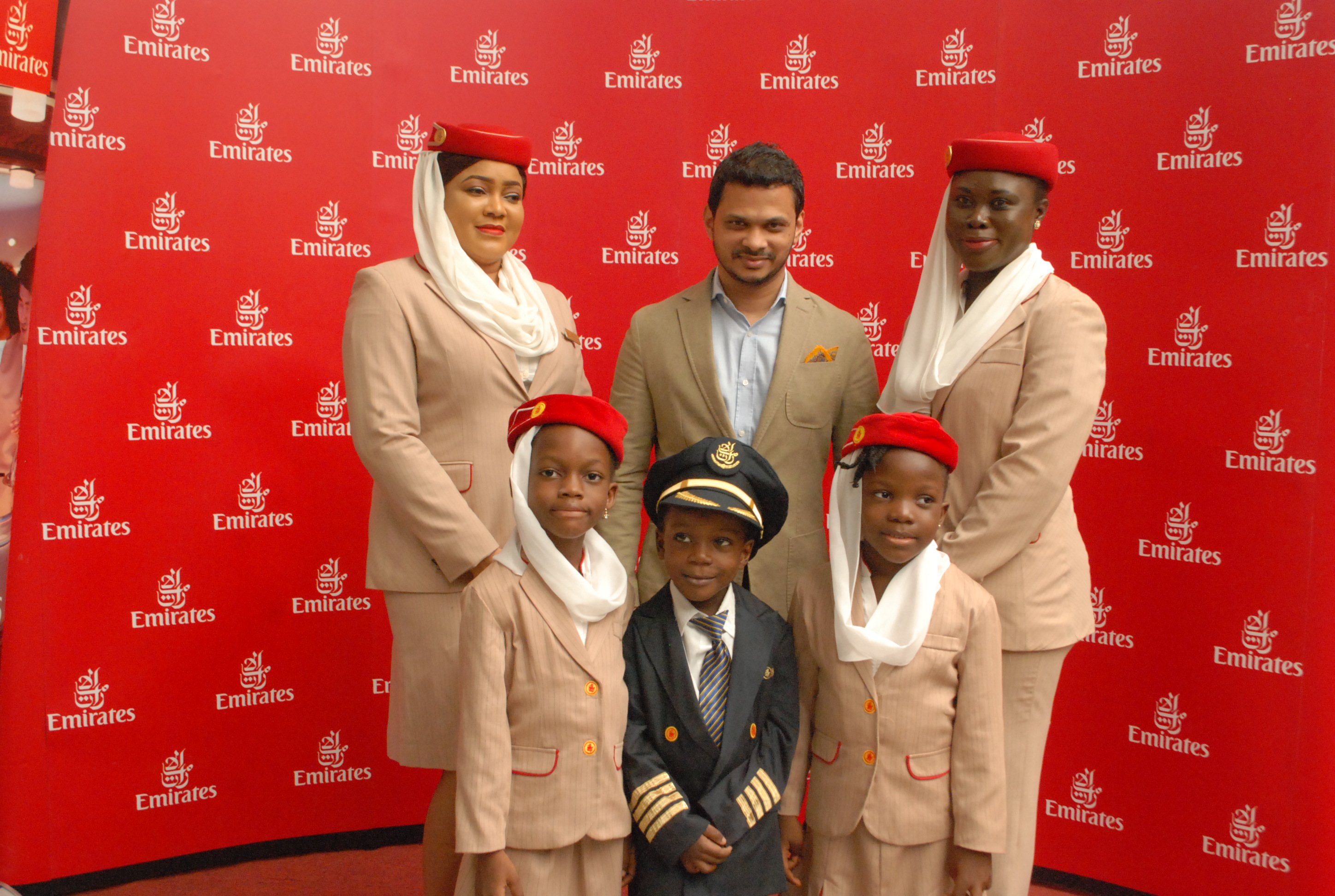 Emirates Senior Customer Sales and Service agent, Doris Akindele; Emirates Regional Manager, West Africa, Afzal Parambil; Emirates Customer Sales and Service agent, Mopelola Afonja, and some journalist's children at the Emirates Children's Day event held at Maryland Mall recently.